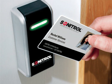 woman using key card to access secure area